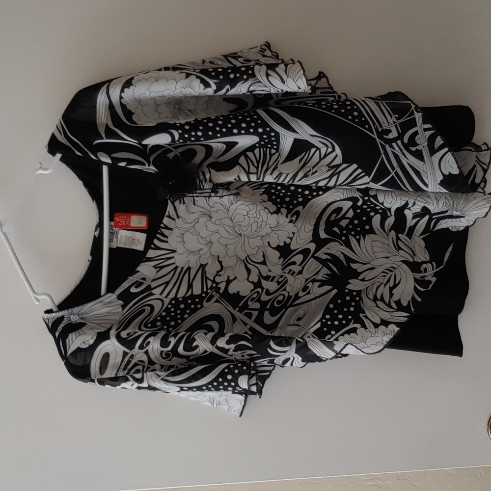 Beautiful light weight pullover black shell with blk/wht floral draped overlay